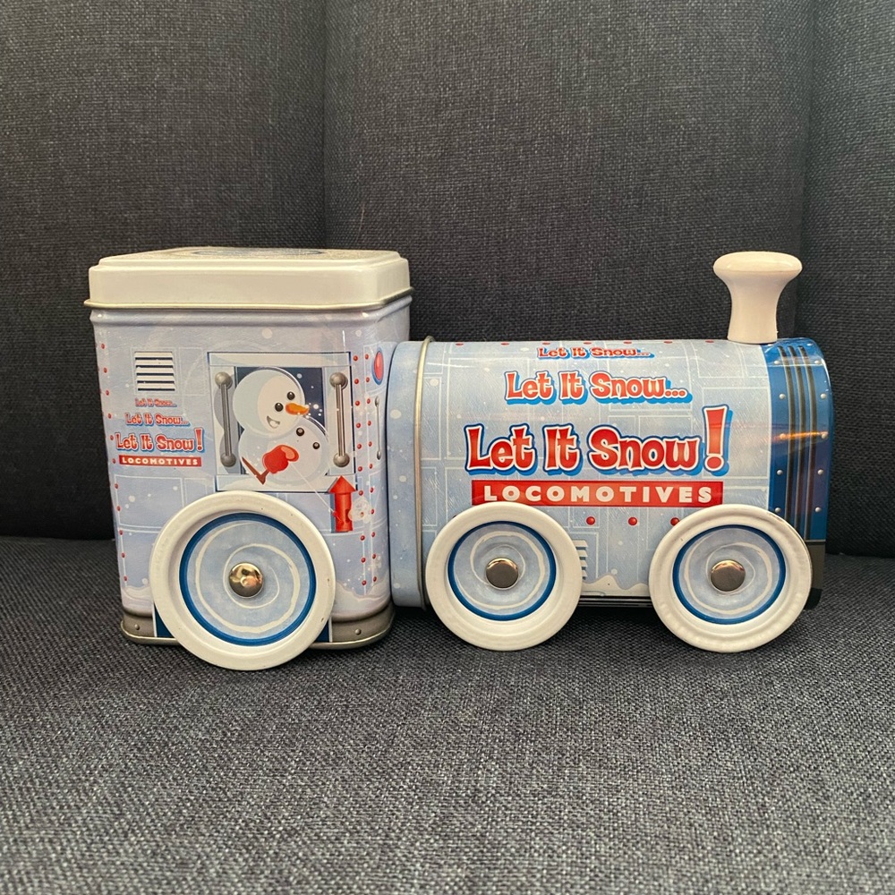 Adorable snowman train tin with wheels